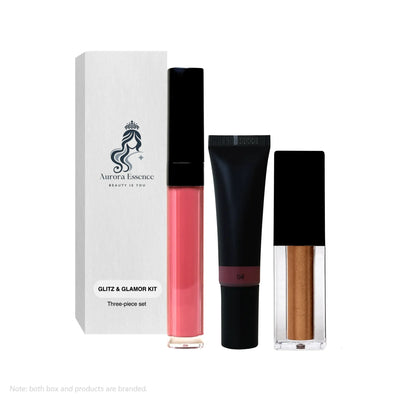Three-piece cosmetic Glitz & Glamor set with lip gloss, cream, and box on a white background
