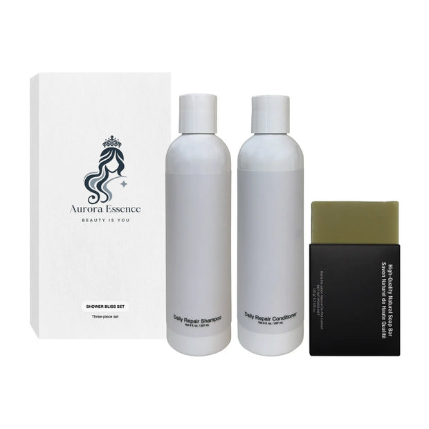 Aurora Essence shower bliss set with shampoo, conditioner, and bar soap on a white background