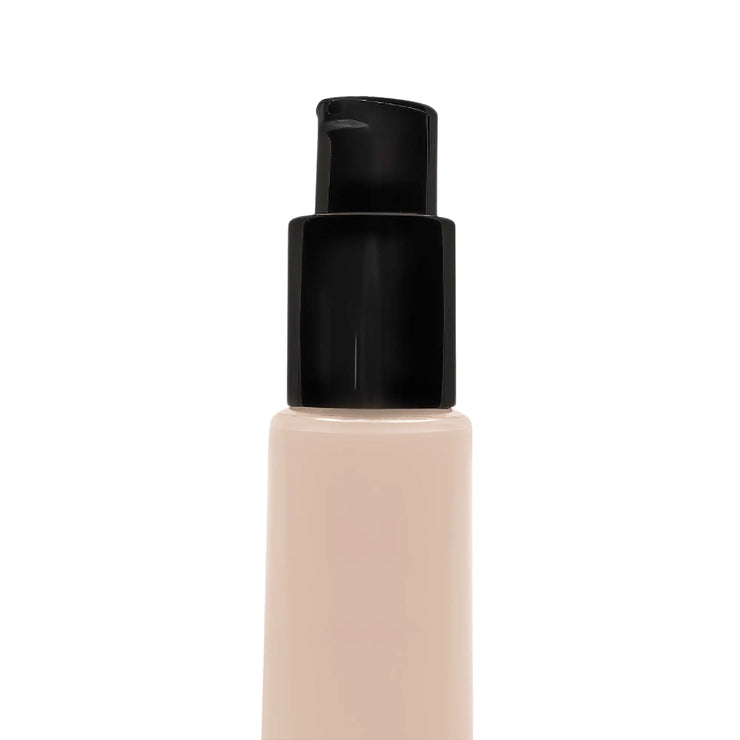 Foundation bottle of BB Cream with black cap on a white background