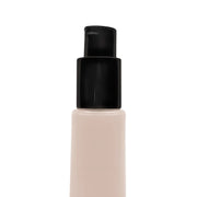 Foundation bottle of BB Cream with black cap on a white background