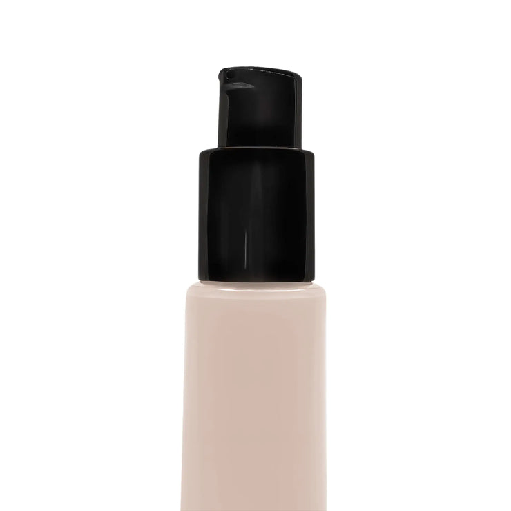 Foundation bottle of BB Cream with black cap on a white background