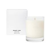 Scented candle with a white label on a white background
