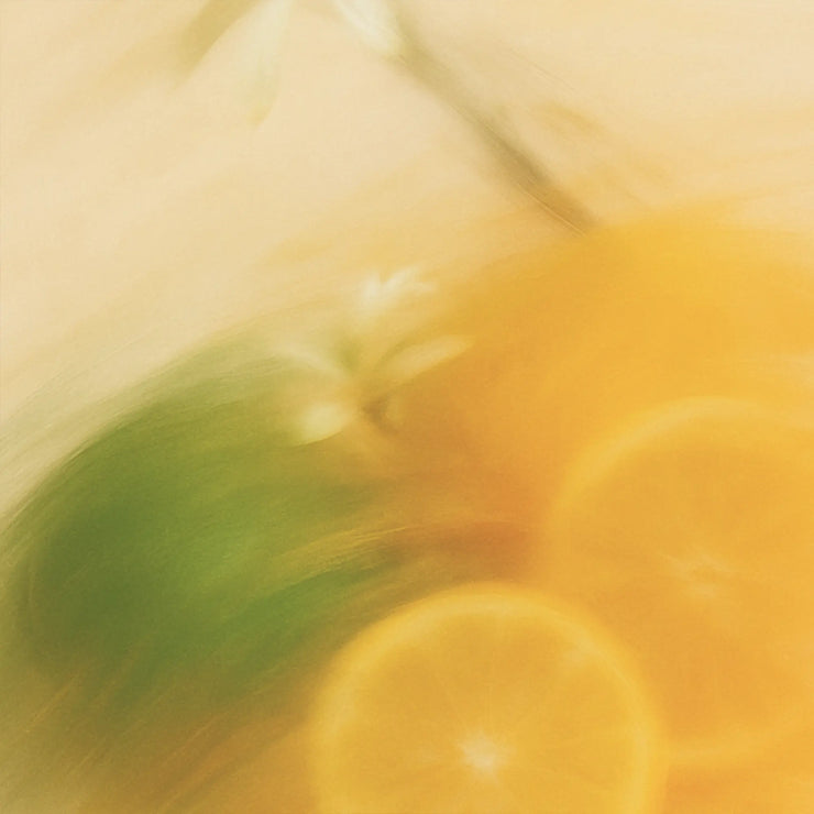 Blurry image of a person lying on a bed with green pillow and yellow blanket.
